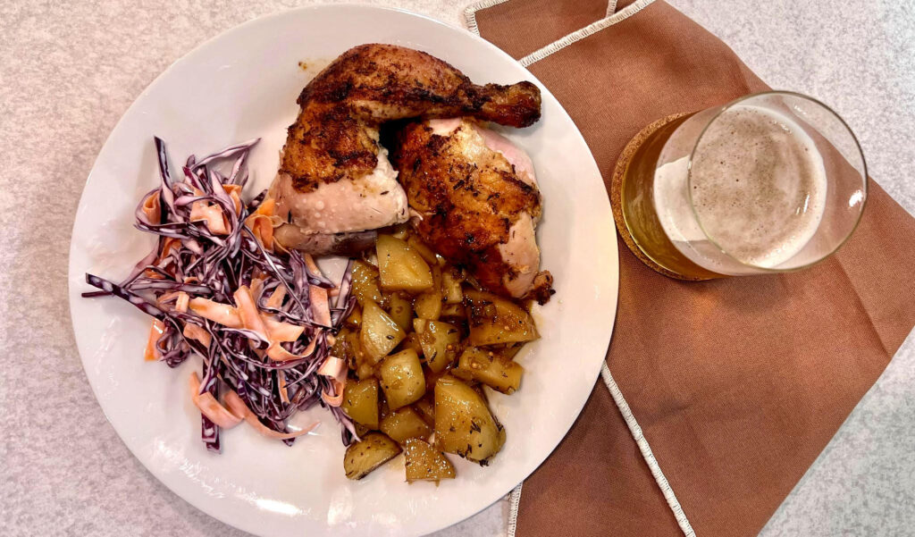 Beer Can Chicken, complete with coleslaw side and roasted potatoes and a cold beer